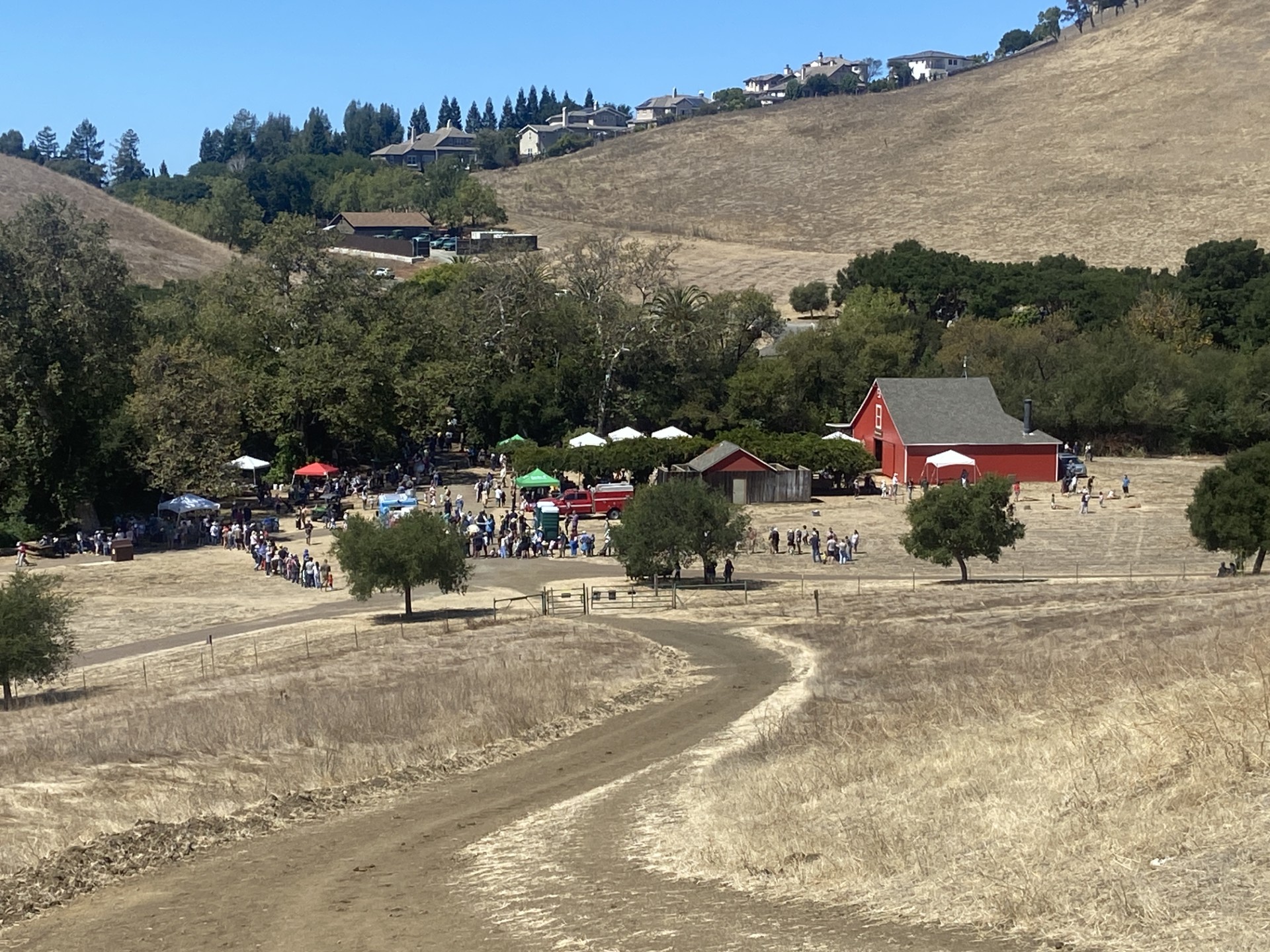 Garin Regional Park Apple Festival with visitors near the historic red barn